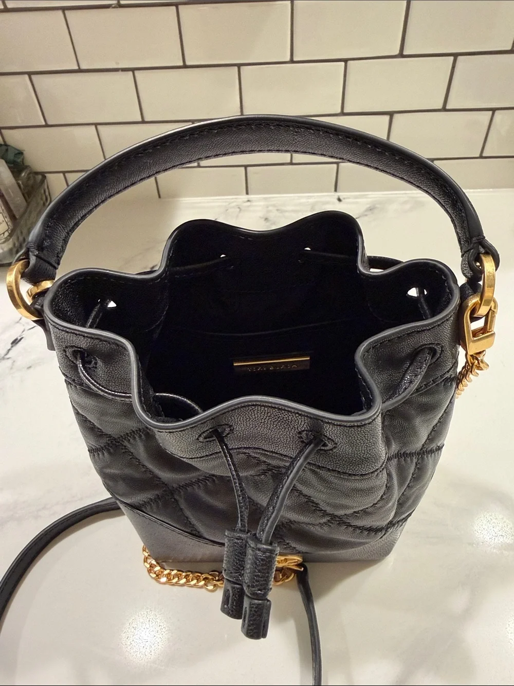Tory Burch Black Leather Drawstring Mini Bucket Bag with Gold Logo